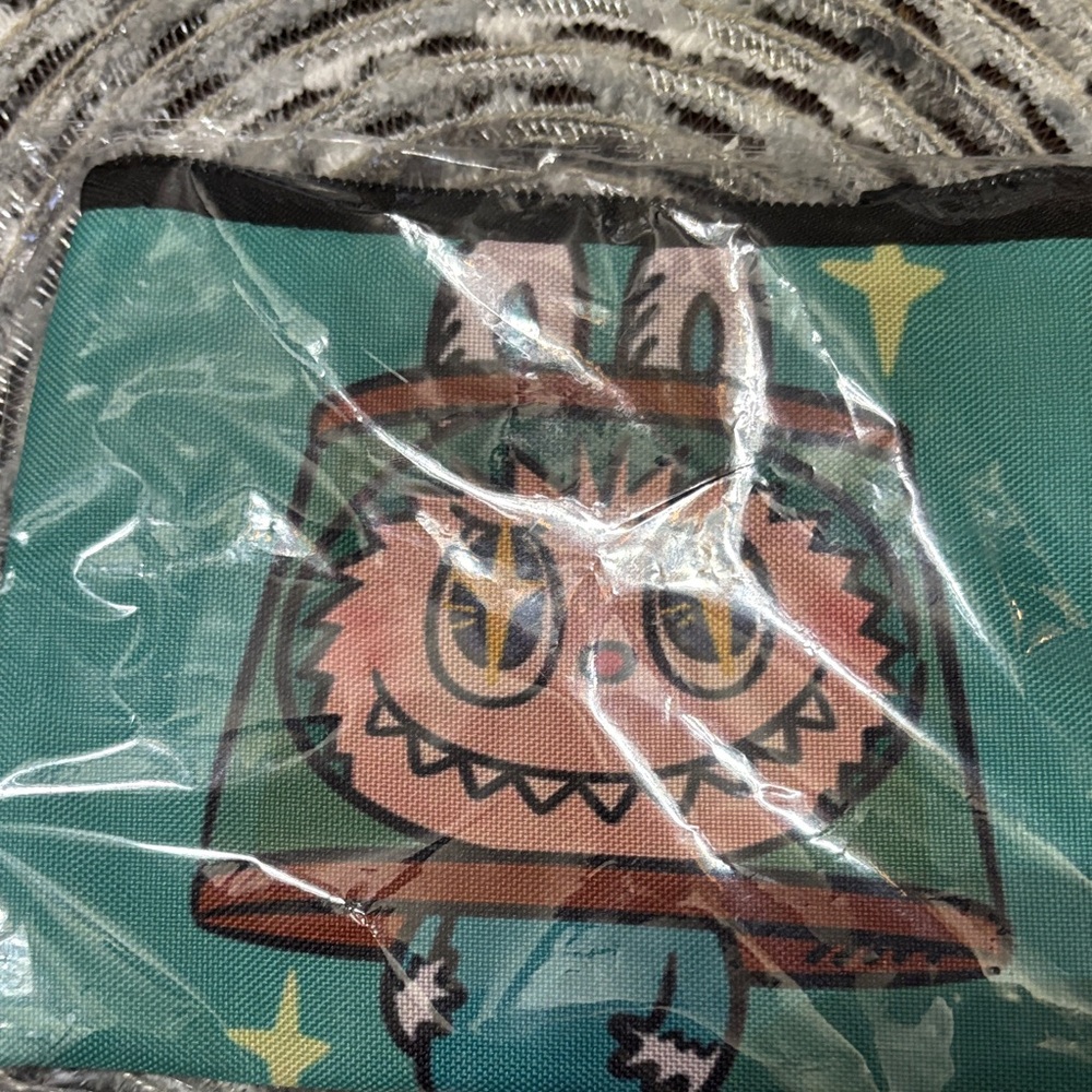 Teal Cartoon Character Pouch